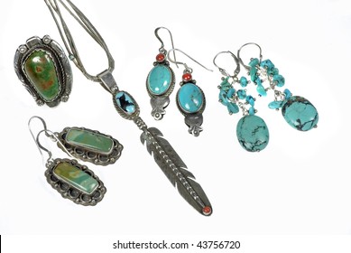 An Assorted Collection Of Handcrafted Silver And Turquoise Native American Jewelry Isolated On White Background.