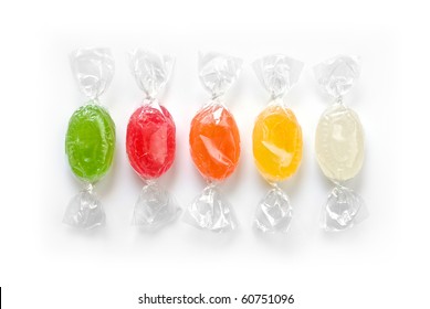 assorted colorful candies in plastic wraps isolated in white background - Powered by Shutterstock