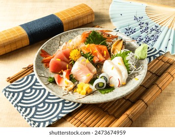 Assorted Comprehensive Sashimi with Dory sashimi, salmon sashimi, Tuna fish, swordfish served in plate isolated on napkin side view on wooden background of Japanese food - Powered by Shutterstock