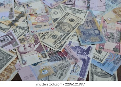 Assorted currency notes from different countries from the world. Background photo for foreign  exchange currency.