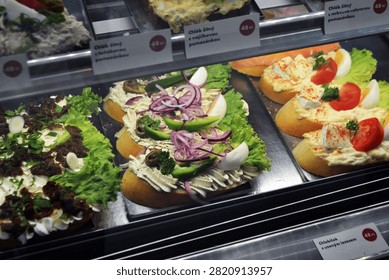 Assorted czech open faced chlebicky sandwiches with eggs tomatoes lettuce and creamy spreads for deli counter menu background.
