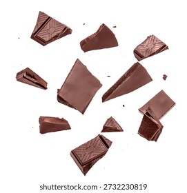 Assorted dark chocolate chunks and broken pieces isolated on white background, minimal food composition with copy space.