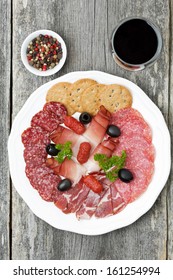 Assorted Deli Meats And A Glass Of Wine, Top View, Vertical