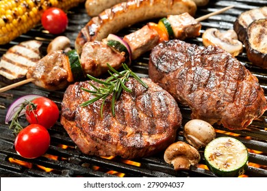 Assorted delicious grilled meat with vegetable over the coals on a barbecue - Shutterstock ID 279094037