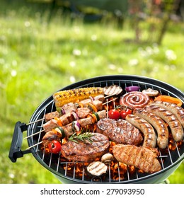 Assorted delicious grilled meat with vegetables over the coals on barbecue - Shutterstock ID 279093950
