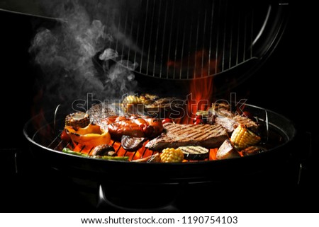 Assorted delicious meat and vegetables on barbecue grill
