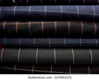 assorted difference type of wool fabric in bespoke boutique shop 