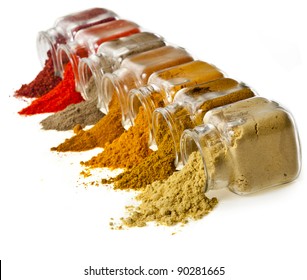 Assorted  different colorful powder spices in glass bottle isolated on white background - Powered by Shutterstock