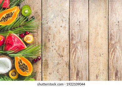 Assorted different summer tropical fresh raw fruits and berries. Clean eating, healthy lifestyle, diet and vitamin concept. Top view flatlay wooden table background - Powered by Shutterstock