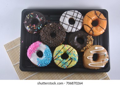 Assorted donuts isolated on white background.