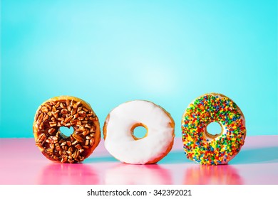 Assorted Donuts On Pastel Blue And Pink Background