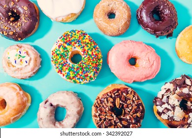 Assorted Donuts On A Pastel Blue Background