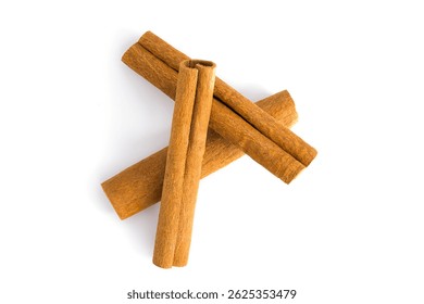 Assorted dried cinnamon bark segments laid out on white, revealing their intricate patterns, coarse surfaces, and deep brown shades, ideal for food and herbal imagery.