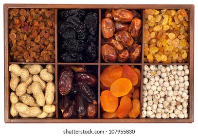 Assorted Dried Fruits In Wooden Box,isolated On White Background.Raisin,prune,date,monkey-nut, Apricot,nuts