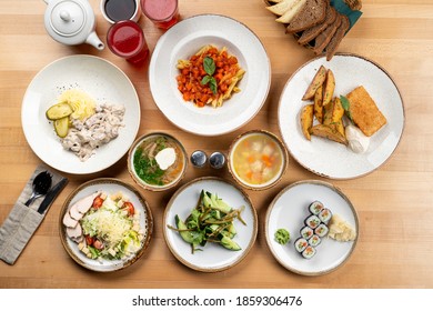 Assorted European Meals On A Wooden Table Of A Cafe, No People, Above Shot