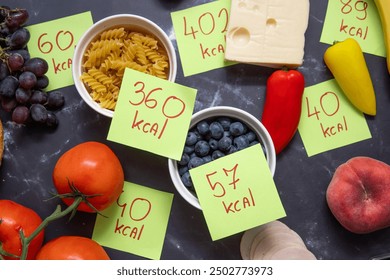 Assorted foods with calorie count labels, illustrating healthy diet and calorie tracking.