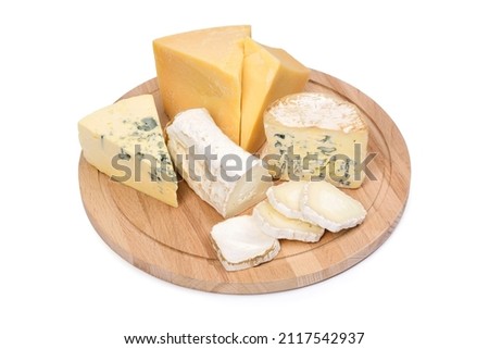 Assorted four types of cheeses on a wooden board, isolated on a white background. Ripe parmesan, goat cheese with white mold, roquefort and dorblu.