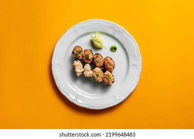 Assorted Four Types Of. On A White, Round, Ceramic Plate, There Are Gunkan With Tuna Tartare, Gunkan With Crab Meat, With Salmon Tartare, Gunkan With Scallop. Each Gunkan Has Two Pieces.