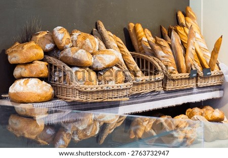 Assorted fresh bread on counter in European bakery