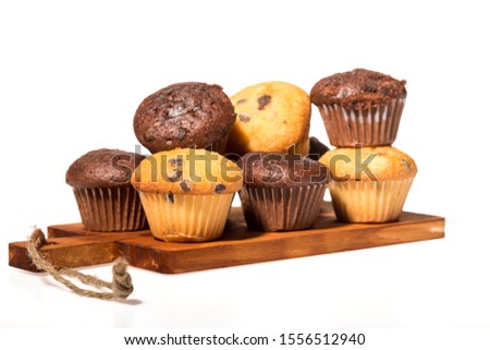 Assorted fresh delicious muffins isolated on a background.