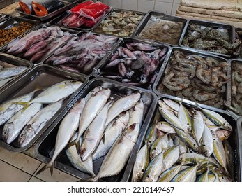 Assorted Fresh Fish, Squid, And Prawns Sold In The Traditional Market