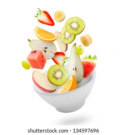 Assorted Fresh Fruits Flying In A Bowl/ Light Salad With Flying Fresh Fruits