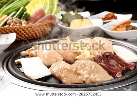 Assorted grilled beef intestines, including tripe, abomasum, and rectum, a Korean delicacy.