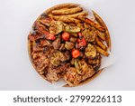 Assorted grilled meat and vegetable platter top view