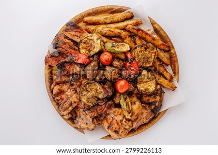 Assorted grilled meat and vegetable platter top view