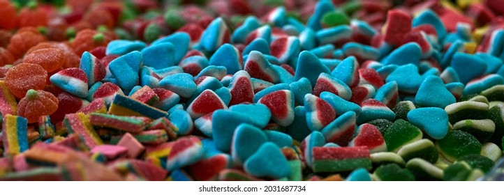 Assorted gummy candies and jellies as background. A lot of colorful jelly sweets candy flavor. Selective focus. High quality photo
