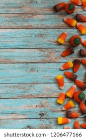 Assorted Halloween Candy Decorations On Rustic Blue Background