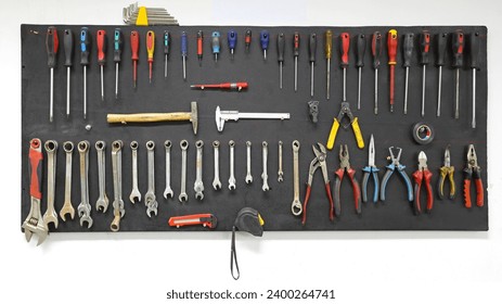 Assorted hand tools in an organized room. Variation of Work Tools in an Indoor Room. Various Hand Tools Arranged in an Organized Order Inside a Room. Variety of screwdrivers in an organized indoor 