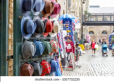 Assorted hats on display at Camden market in London - Powered by Shutterstock