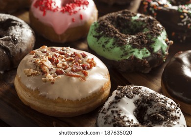 Assorted Homemade Gourmet Glazed Donuts on a Background - Powered by Shutterstock