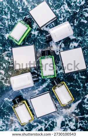 Assorted hygiene product bottles and boxes are displayed on a marble surface, featuring blank labels for potential branding and design applications