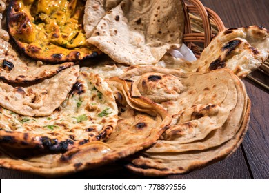 Assorted Indian Bread Basket includes chapati, tandoori roti or naan, paratha, kulcha, fulka, missi roti
