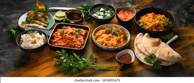 Assorted indian food on black background.. Indian cuisine. Top view with copy space. pANORAMA, ANNER