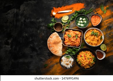 Assorted Indian Food On Black Background.. Indian Cuisine. Top View With Copy Space