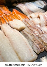 Assorted Kinds Of Fresh Fish Fillets For Sale In Supermarket Or Fish Monger. Cod, Char, Trout, Salmon.