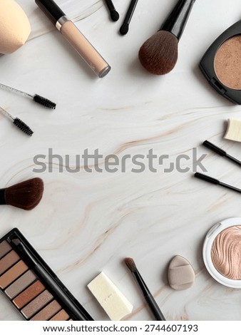 Assorted Makeup And Beauty Tools Flat Lay On Light Marble Surface