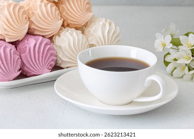 Assorted marshmallows for breakfast with a cup of fragrant coffee