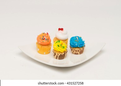 Assorted mini cupcakes presented on a plate