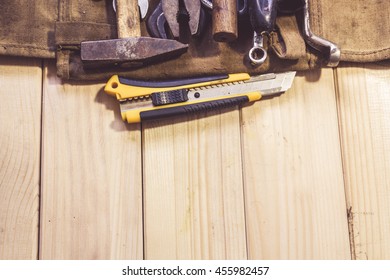 Assorted mixed work tools on wood