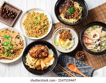 Assorted noodle soup, Pork Knuckle rice Bento, Chili Sauce Noodles, Shredded Pork Fried Rice, Dayang Chun Noodles Dry, Fried Pork Rice, in a dish isolated on wood table side view taiwan food - Shutterstock ID 2147519447