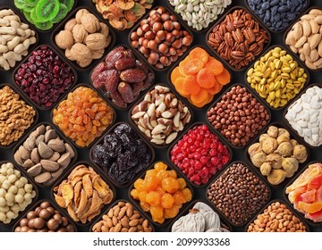 assorted nuts and dried fruits, colorful food background. - Shutterstock ID 2099933368