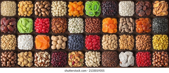 assorted nuts and seeds, various kinds of dried fruits, sun-dried berries. composition organic food background, top view. - Shutterstock ID 2133019355