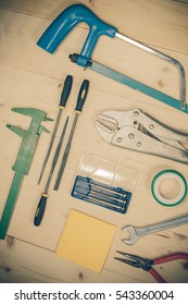 Assorted objects tool on wood.
