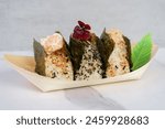 assorted onigiri on a white marble background