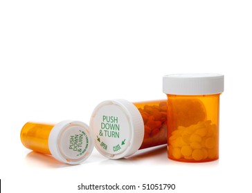 Assorted Orange Medicine Bottles On A White Background