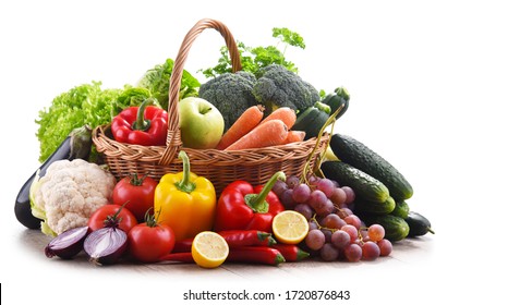 Assorted organic vegetables and fruits in wicker basket isolated on white background. - Shutterstock ID 1720876843